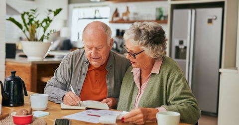 senior couple managing home finances 