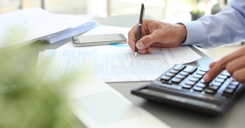 Tax accountant working with documents at table