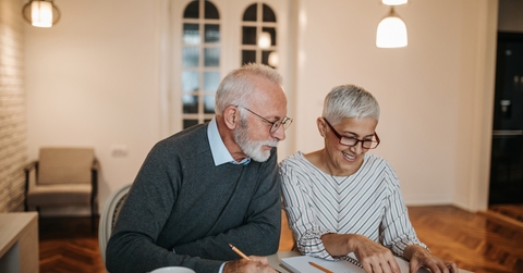 senior couple calculating their expenses
