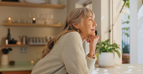 woman thinking at home for retirement
