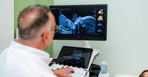 gynecologist using modern ultrasound scanner