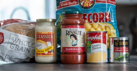 Several containers of grocery food products on kitchen counter