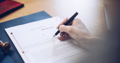 A will is signed by a female notary