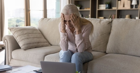 stressed older woman on couch
