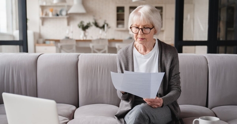 senior woman reviewing paperwork