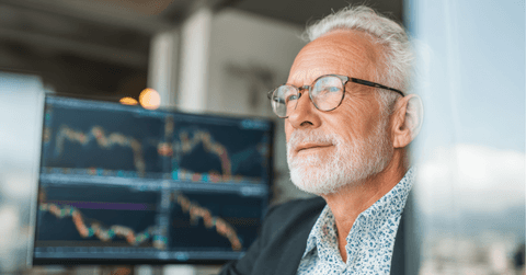 Older man looking at stock market