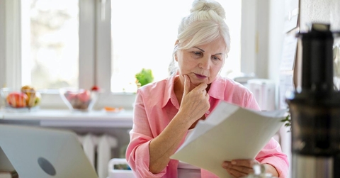 senior woman reviewing papers