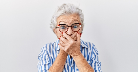 A surprised senior woman