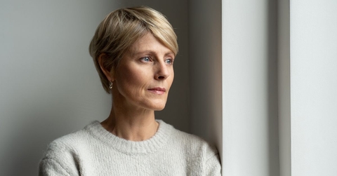 Thoughtful looking woman in her 50s