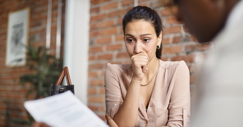 A woman nervouos at her job