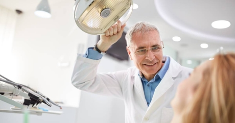 Senior man working as dentist