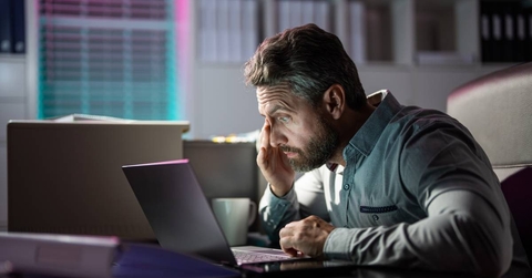 Tired businessman bored at work